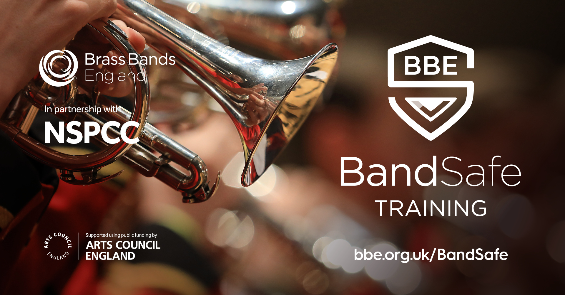 Close up of a cornet being played next to a logo shaped like a shield and consisting of the B and S of Band Safe
