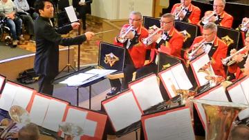 Conductor conducting brass band