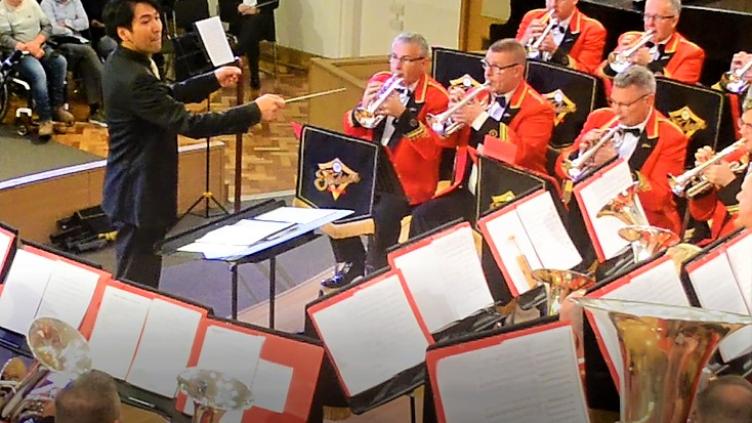 Conductor conducting brass band